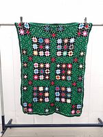Full view of tablecloth hanging to show overall pattern and size