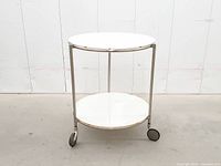 Full view showing round two-tier trolley
