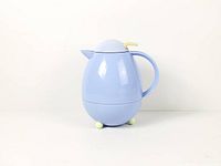 Full side view of carafe showing body, handle, feet