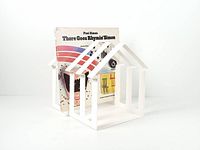 Front angle view showing house silhouette rack holding an LP record