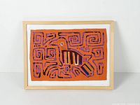 Full view of framed mola artwork