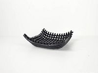 Angled side view of entire black ceramic lattice basket