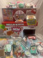 Overall lot showing display case, bags of accessories and blind balls