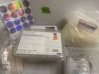 Overview of lot including wax flakes, soap bases, wicks, sticks, cutters, stickers