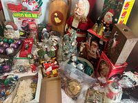 Overview of entire lot showing Rushton Santa, boxed lights, ornaments and decor
