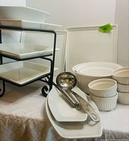 Overall lot showing tiered stand with plates, platters, CorningWare bowls and ramekins