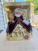 Front view of boxed 1996 Happy Holidays Barbie showing doll and gown