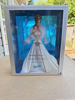 Front of unopened Barbie Holiday Visions Snow Queen box showing doll and branding