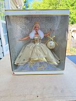 Front of unopened display box showing Celebration Barbie doll and ornament