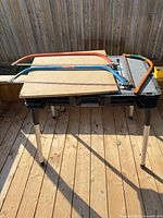 Three bow saws on work table showing overall lot