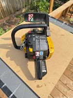 Top and side view of McCulloch chainsaw showing housing, controls and condition