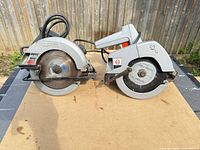 Two corded circular saws side by side