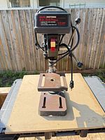 Front view of Sears Craftsman 8-in benchtop drill press on table