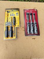 DeWalt screwdriver set and Husky chisel set sealed in packaging