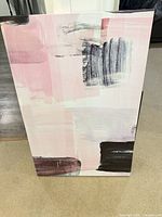 Front view of abstract pink, black and white stretched canvas wall art
