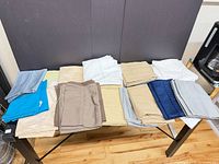 Full table view showing all folded pillowcases in assorted colors