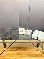 Group shot of pedestal stand, three canisters and trays