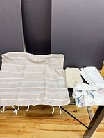 Full view of striped table runner and stacked napkins