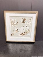 front view showing floral print, frame, matting and overall condition