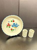 Plate on stand with two candle holders