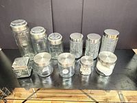 all 11 glass jars displayed on table