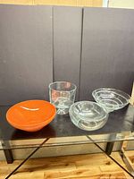 Group shot of four bowls on glass table
