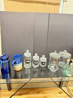 Group shot of all ten items lined on glass table