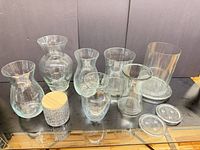 All ten decorative pieces arranged on glass shelf