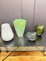 Group shot of all four vases on table
