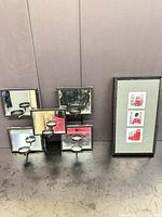 Front view of multi-mirror candle holder and framed triple print