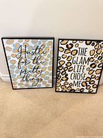 Both framed leopard print inspirational posters side by side