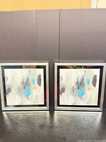 Front view showing both framed art pieces
