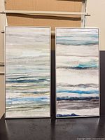 Front view of both framed abstract prints