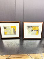 Both framed prints side by side