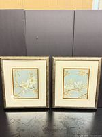 Front view showing both framed floral prints