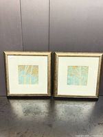 Pair of framed square tree prints side by side
