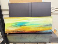 Front view of the panoramic acrylic painting on glass table