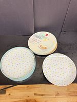 Packaged set of President's Choice polka dot dessert plates with one sample plate displayed