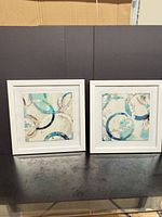 Both framed artworks side by side