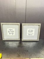 Both square wall signs front view