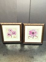 Both framed prints side by side