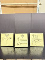 Front view of three square canvas prints