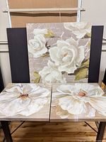 All three floral canvas panels displayed together