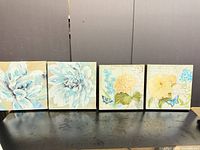 All four square canvas prints lined up