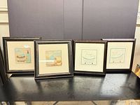 All four framed prints displayed together