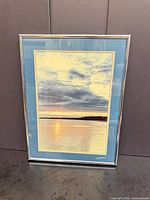 Front view of signed framed seascape print with double mat and silver frame