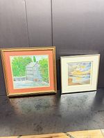 Both framed artworks side by side