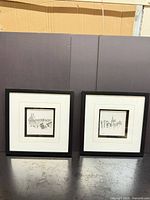 Both framed prints side by side showing overall style and size