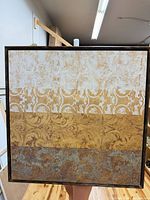 Front view of square framed abstract floral canvas showing three ornamental bands and wood frame