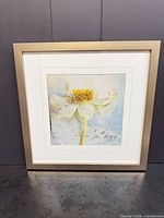 Front view showing entire framed floral print with mat and brushed silver frame